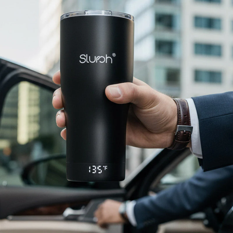 Smart Temperature Control Tumbler held by a commuter